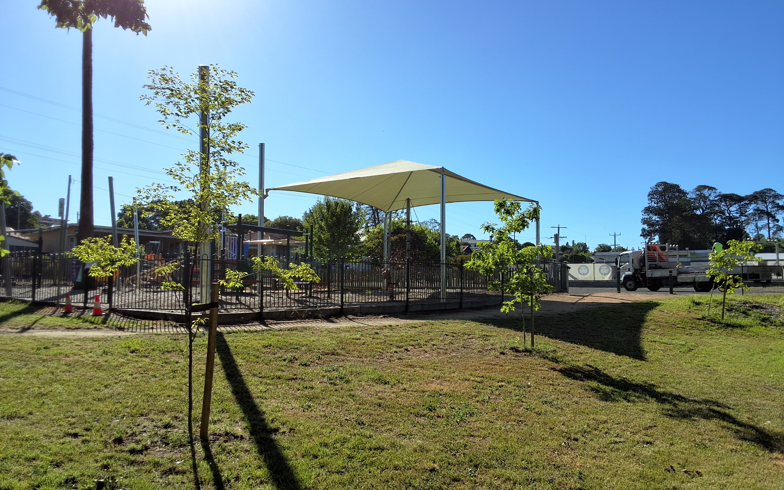 Image of the first section of shade sail installed over the playground
